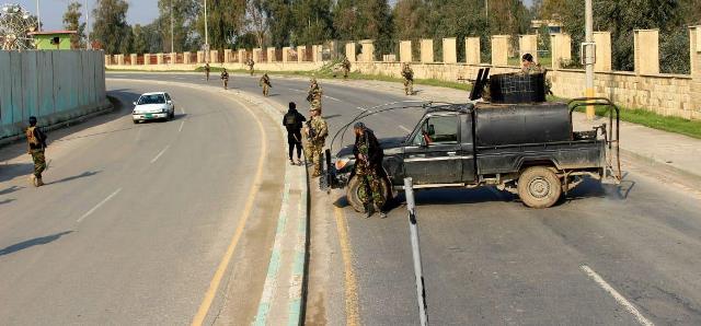 بالصور : الحشد الشعبي يمنع قوة أمريكية من التجول في الموصل